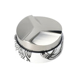Motta 58mm coffee levelling tool with black and white finish and angled stainless steel base.