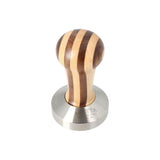 The Motta Striped Wooden Coffee Tamper (58mm, flat base). Featuring an ergonomic striped wood handle and flat stainless steel base.