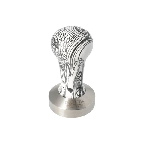 Motta 53mm coffee tamper with flat base and black & white wooden handle, designed for precise espresso tamping and elegant countertop display.
