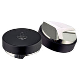 Metallurgica Motta black 58mm coffee levelling tool with angled stainless steel underside and engraved branding.